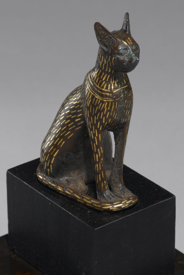 Small bronze and gold sculpture of a cat