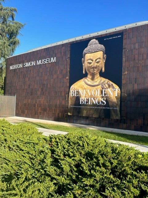 The building banner for Benevolent Beings, featuring a 12th-century Buddha Shakyamuni, which was photographed on the same day as the Dipankara Buddha.