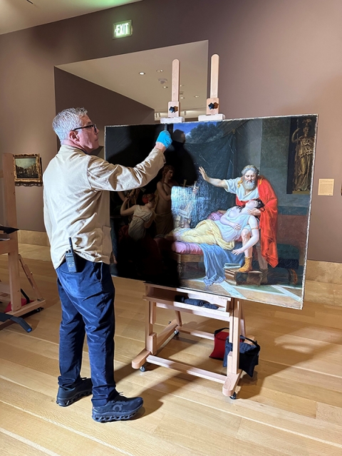 Head of Conservation and Installations John Griswold preparing Louis Ducis’s Sappho Recalled to Life by the Charm of Music for photography in January 2025.